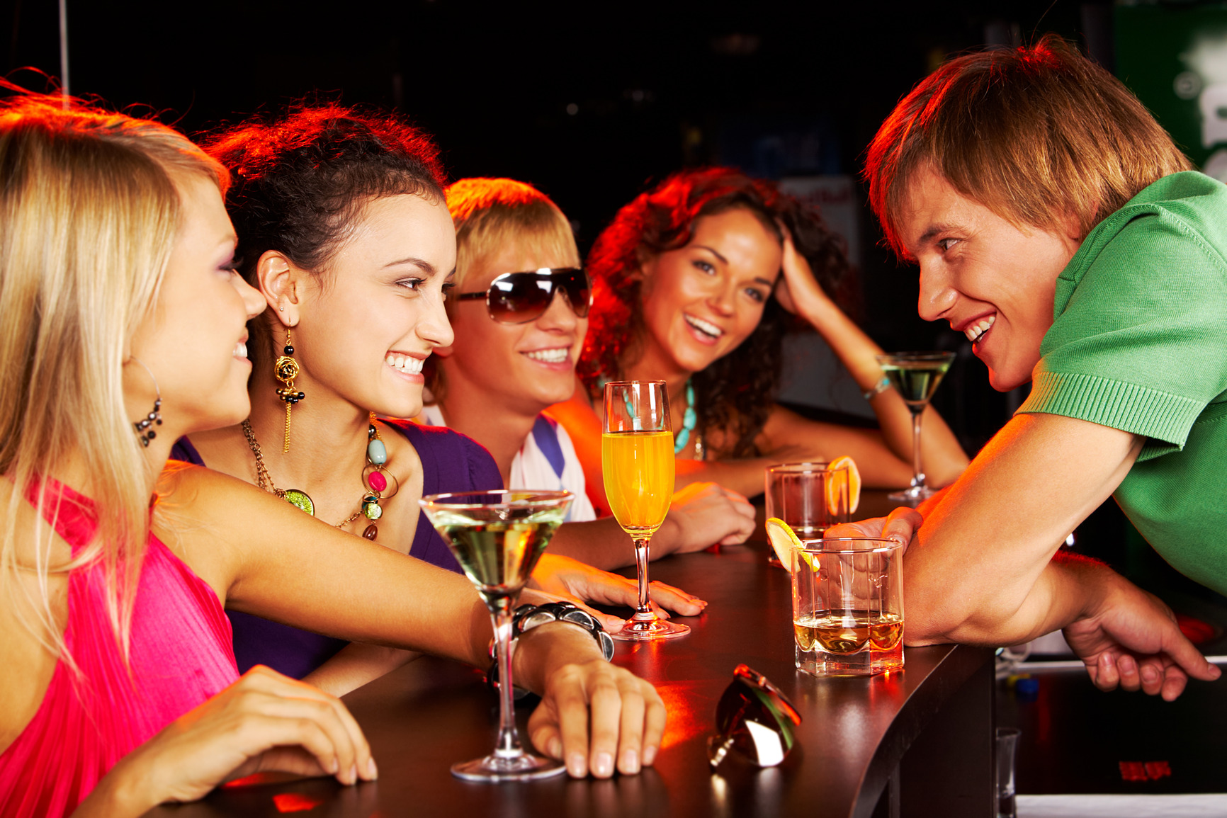 Image of happy teenagers chatting in the bar